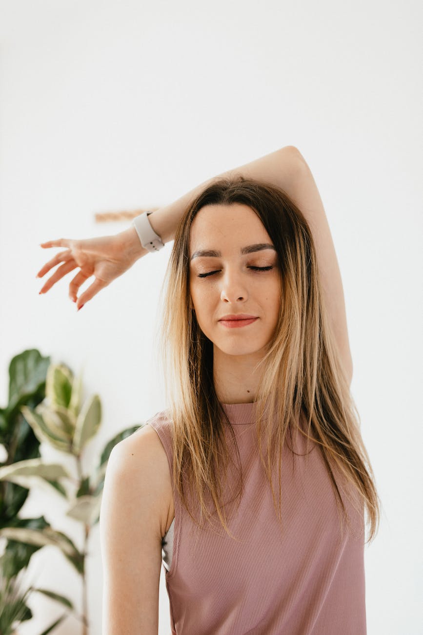 calm young woman practicing yoga meditation